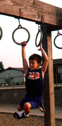 Lee on the monkey bars.