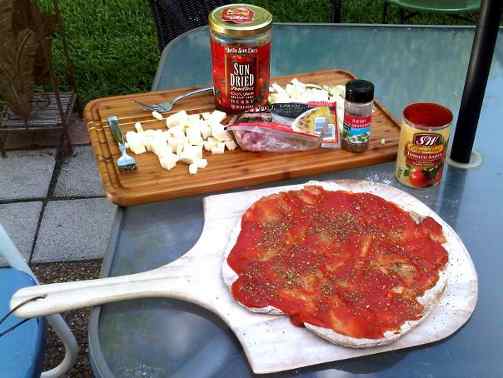 The stuff ready to go - sauce, sundried tomatoes, herbs, cheese.