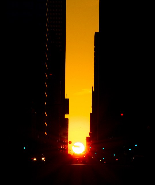 The sun rising in the canyons of Main Street, Dallas.