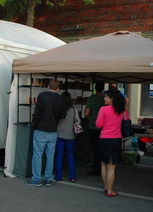 David Pound's booth of little monster heads in wooden boxes at the Deep Ellum Arts Festival always draws a crowd.
