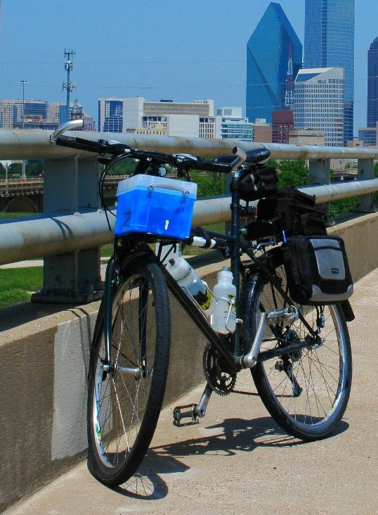 You can see the bag (I think it used to hold a portable DVD player) hanging on the rear rack. Perfect for a Moleskine and some pens.