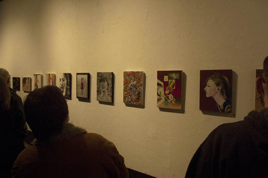 A row of paintings. I chose the one in the middle.