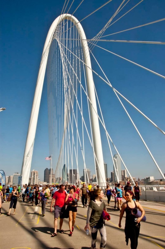 People walking from the yoga event with their mats under their arms. All Out Trinity Festival - Margaret Hunt Hill Bridge, Dallas, Texas (click to enlarge)