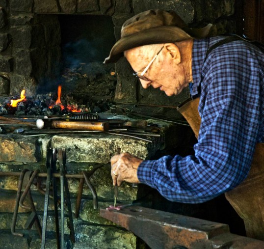 Blacksmith forging a cross, Dallas Heritage Village (click to enlarge)
