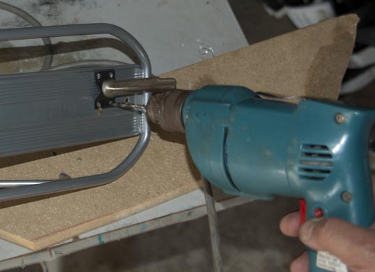 Four mounting holes go into the small front rack. Do this with some care - or the flashlight won't shine straight ahead.