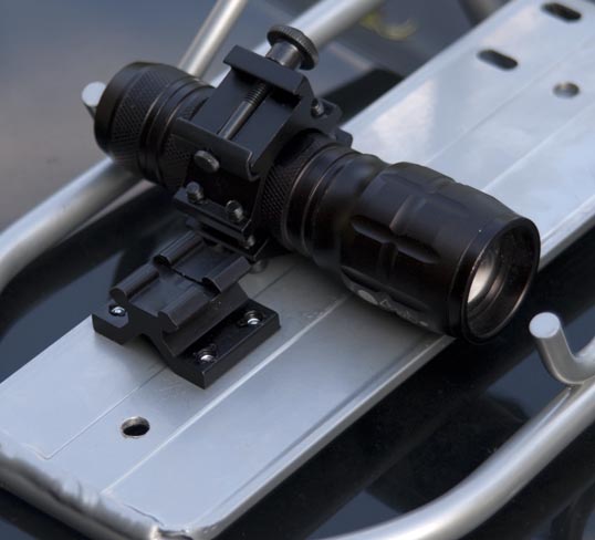 The rail mounted on the rack and the flashlight in the holder. My flashlight was a little too big, so I simply used the longer bolts that come with the unit - the ones that are intended to go around a barrel. 