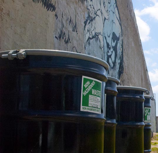 The mural was decorated by non-hazardous waste drums.